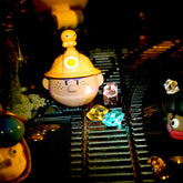 Spring House "Ugly-Cute Family:Wave 6 -Exavation GodGold" series art toy figures in a lifestyle display scene: